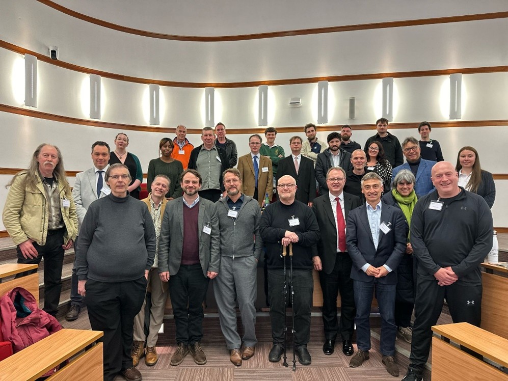 Around 30 people smiling at the camera