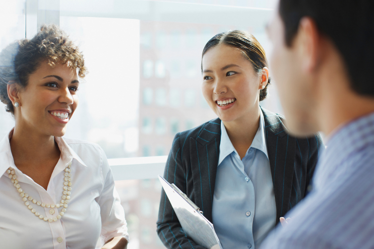 Three business people chatting