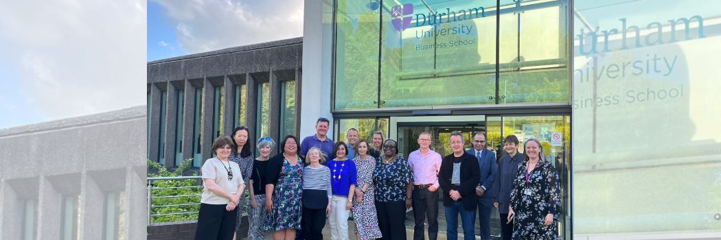 a group of 2021 MBA graduates outside of the School entrance