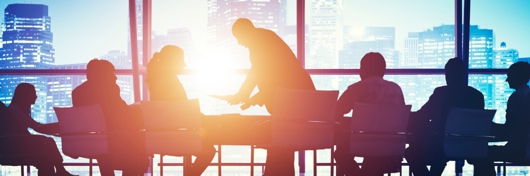 Outline of business people meeting discussion with cityscape in the background