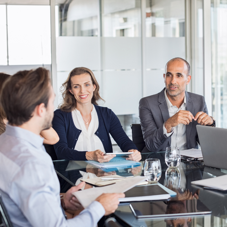 Two men and a woman in a business meeting