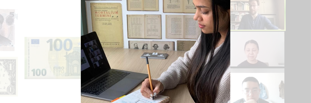 Student writing notes while on a video call