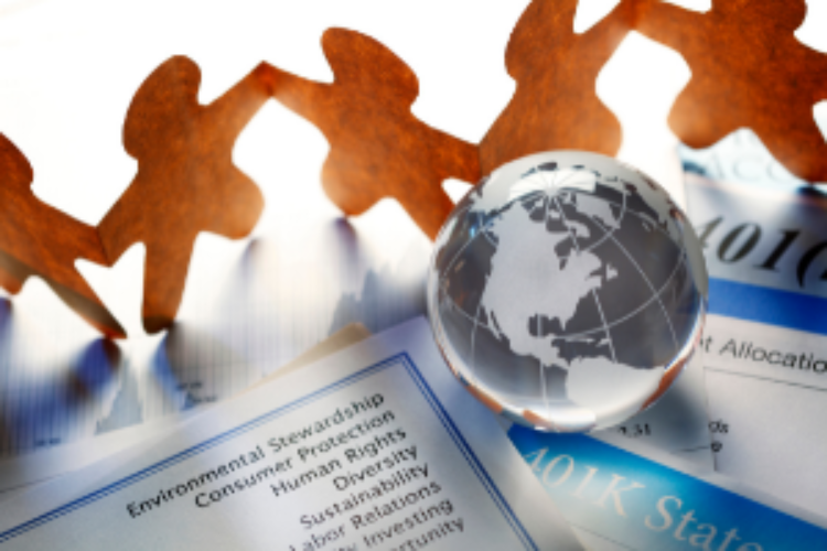 paper people dancing around glass globe