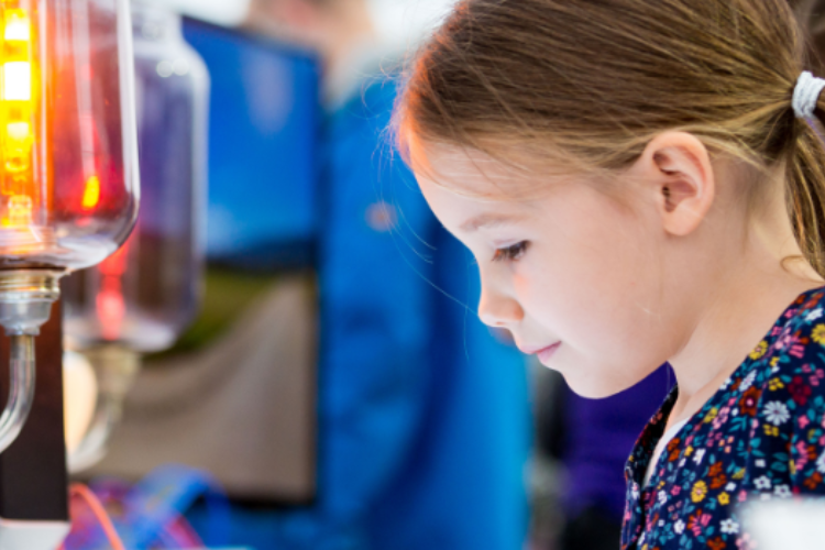 Young girl takes part in a demonstration at Celebrate Science