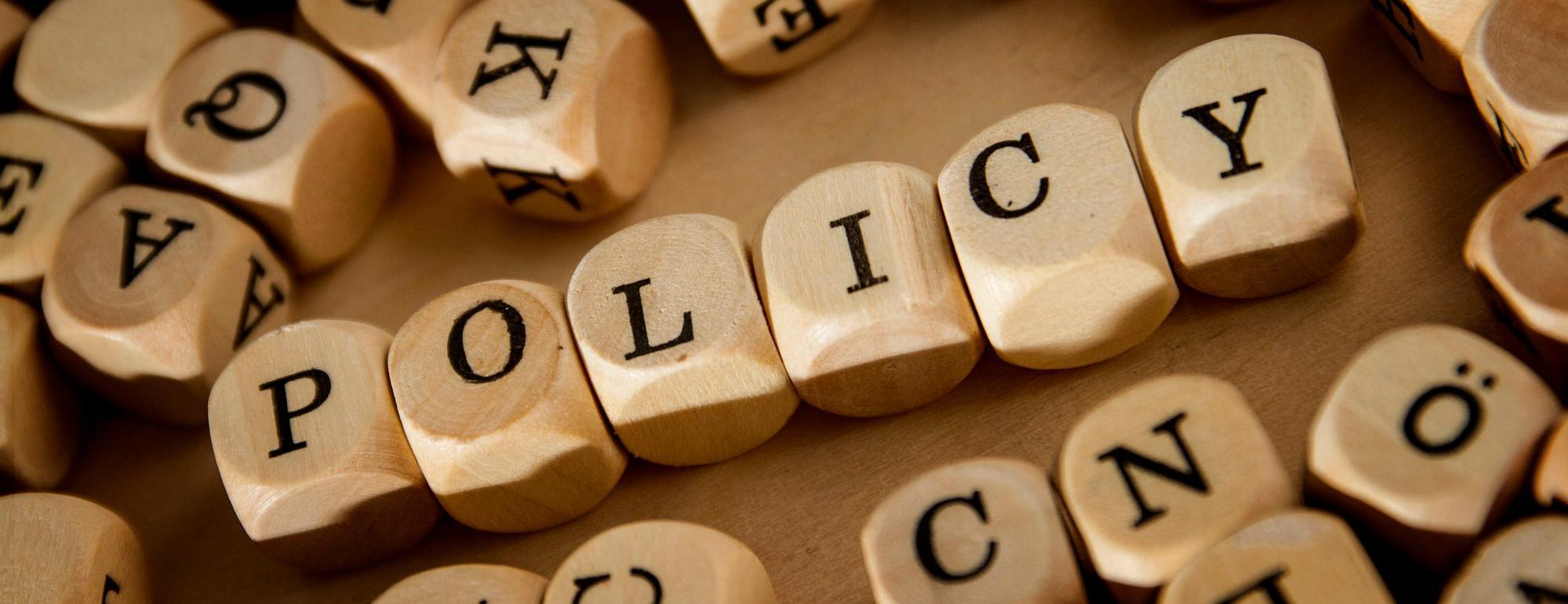 Policy written in lettered cubes