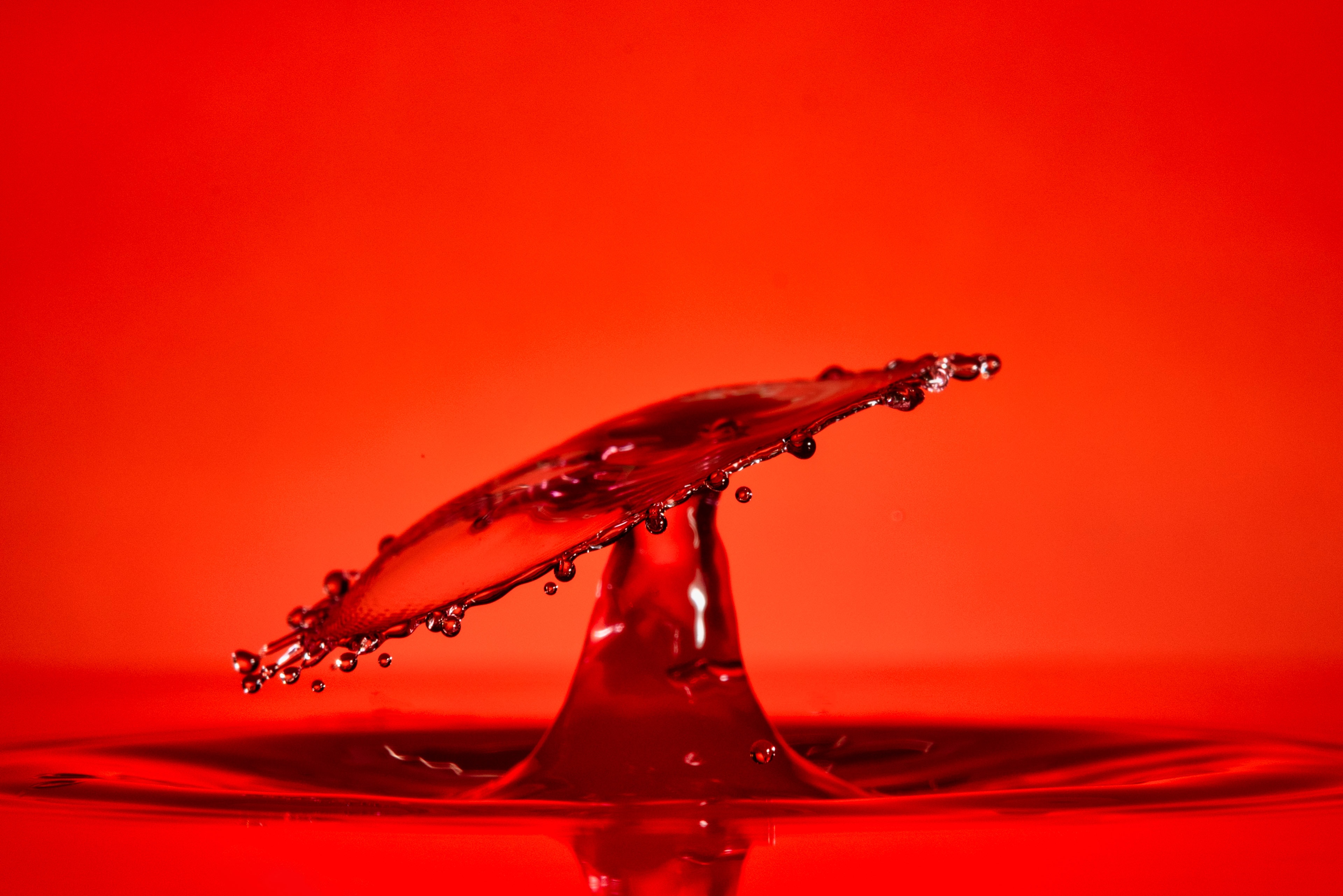 splash of water in red background