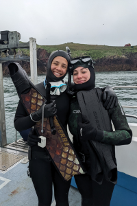 Rebecca Daniel and colleague in wetsuits