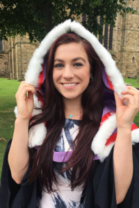 Rebecca Daniel in graduation robes