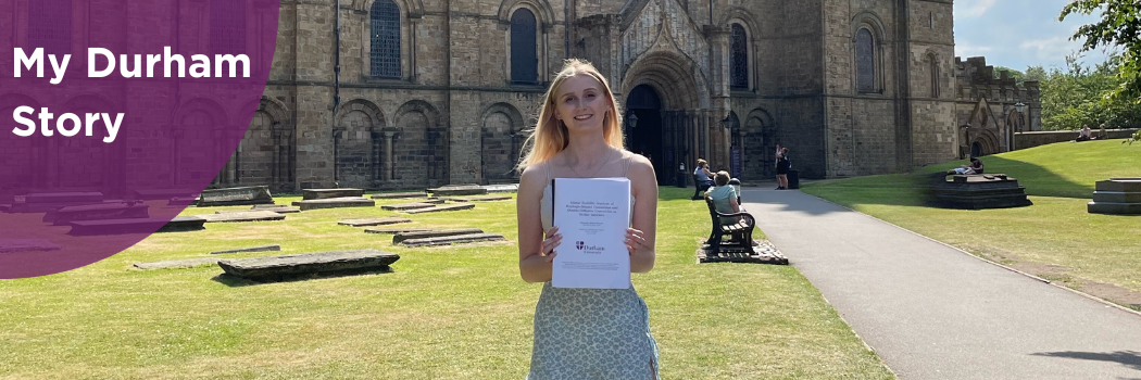 Alex standing in front of the Cathedral with her dissertation