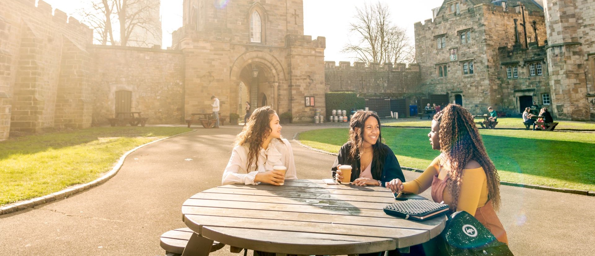 Students sitting in the castle courtyard