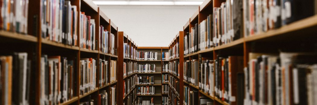 A library corridor with book shelves on either side