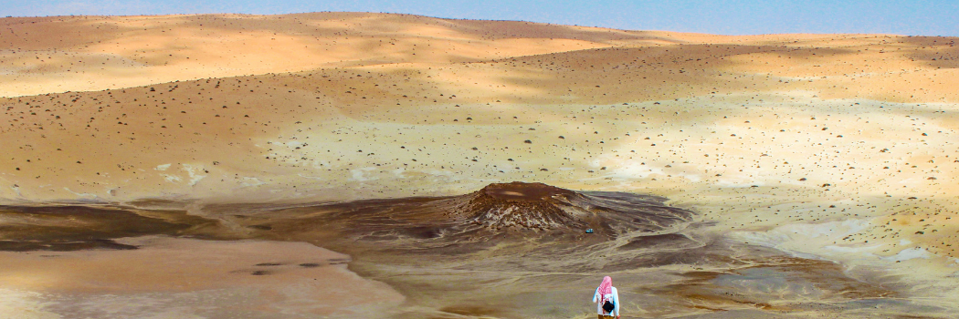 Archaeologists in the Nefud Desert in Saudi Arabia carrying out fieldwork