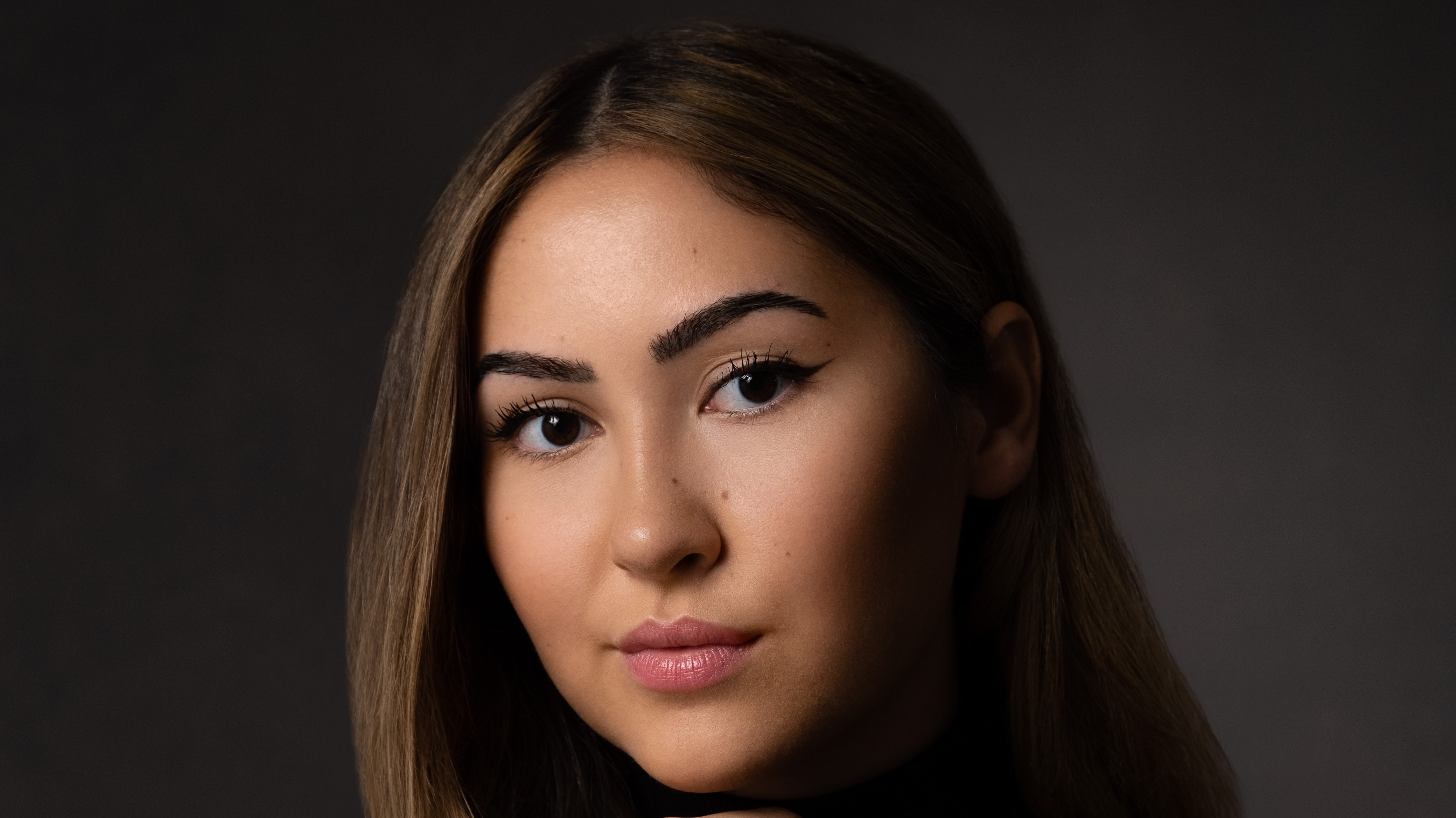 Photograph of Miray Kose, a 1st year law student and author, wearing black