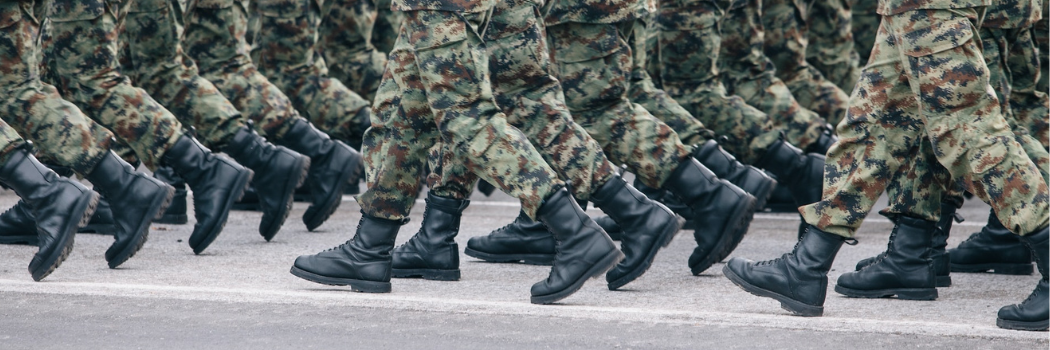 A group of soldiers dressed in camouflage clothing.