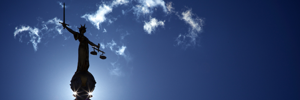 Blue sky and outline of Old Bailey Lady Justice banner