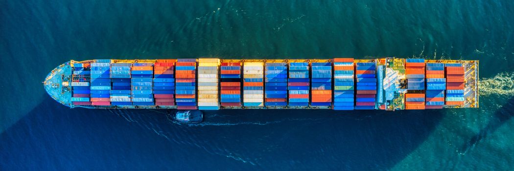 Aerial view of a cargo ship full of shipping containers