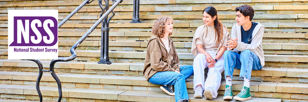 Students sitting on steps in Durham City