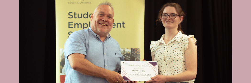 Student receiving award certificate