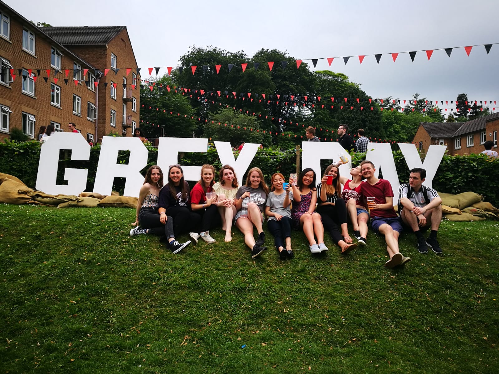 Students gathering together on the lawn outside Grey College