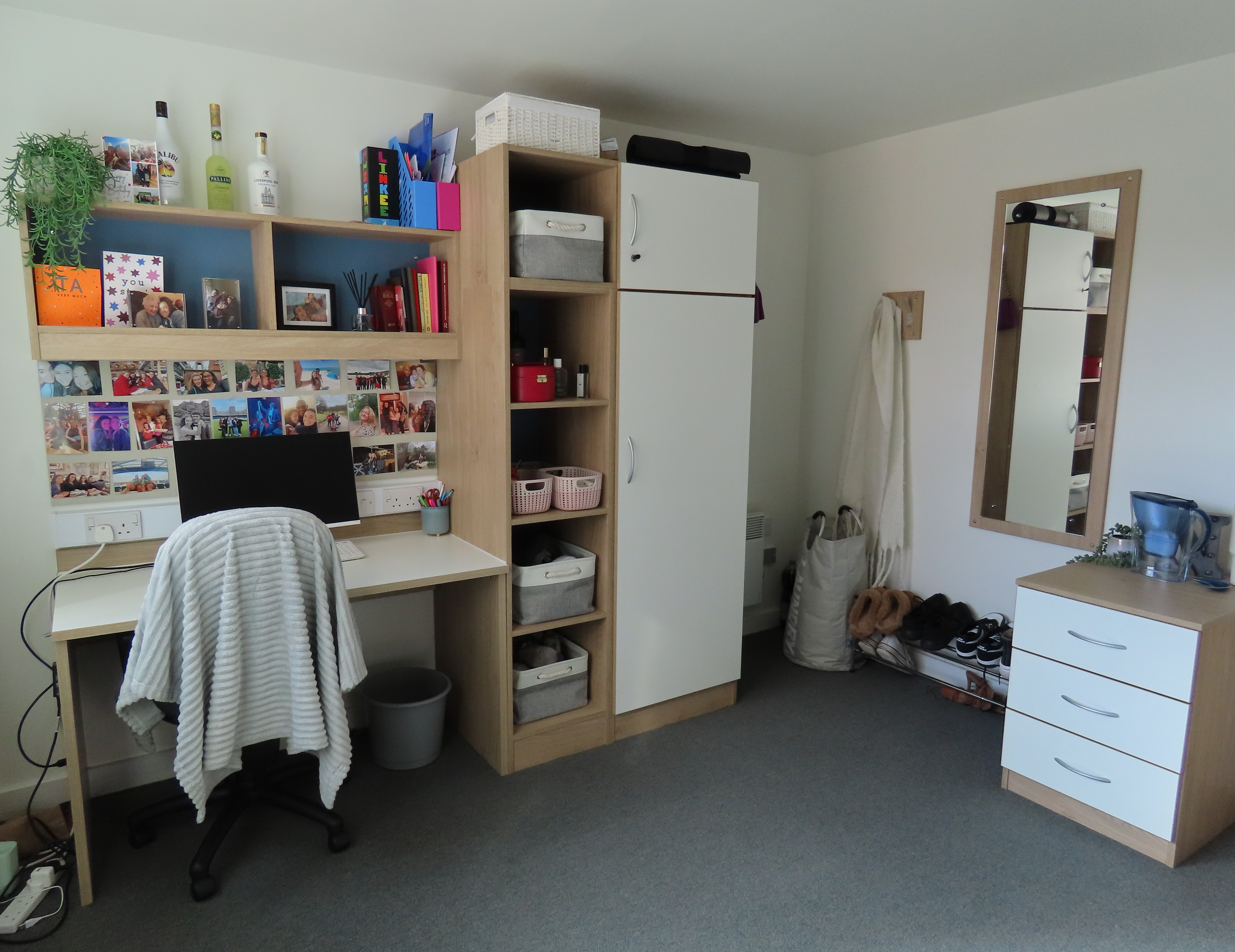 Student accommodation view of student desk and wardrobe.