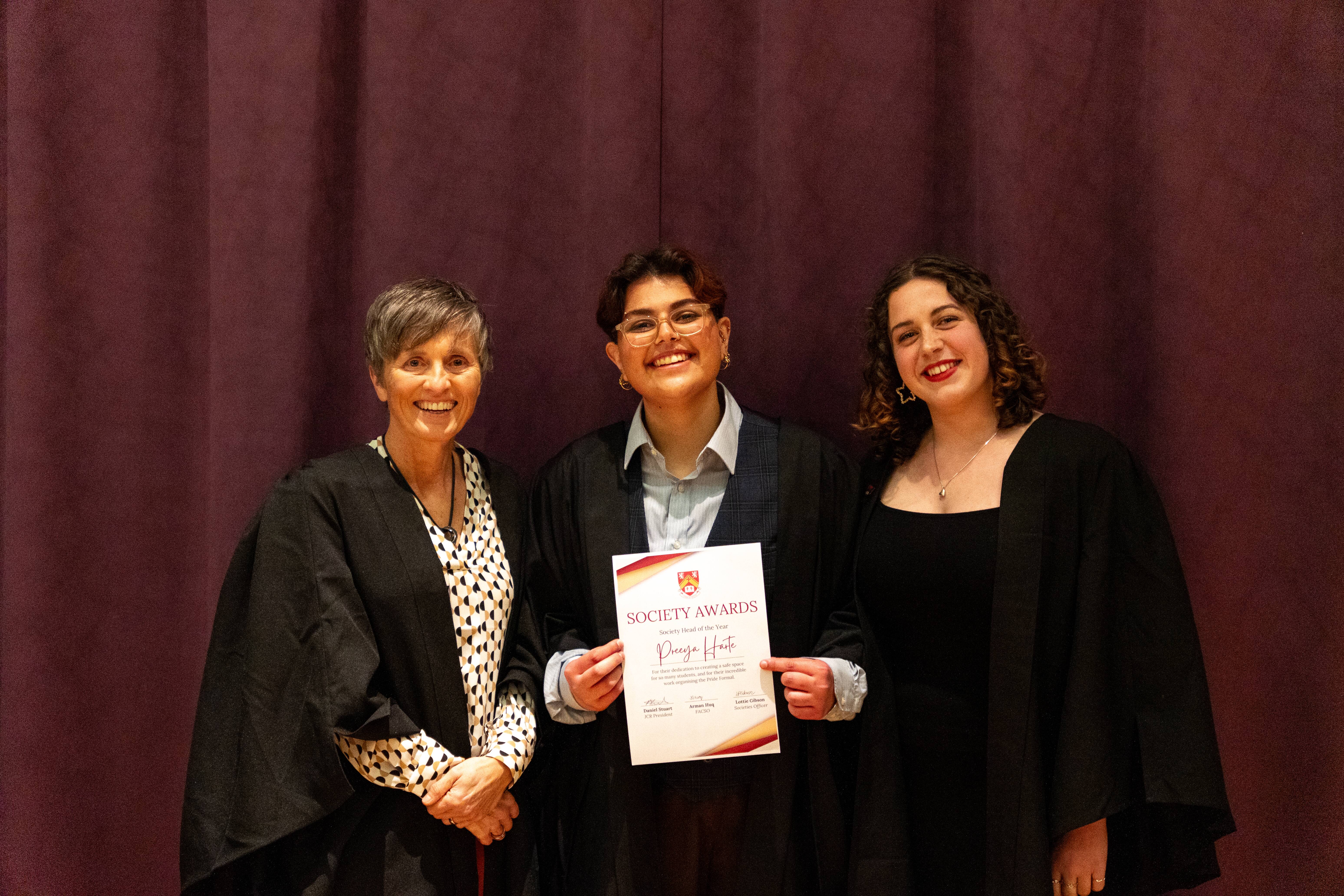 3 women with an award