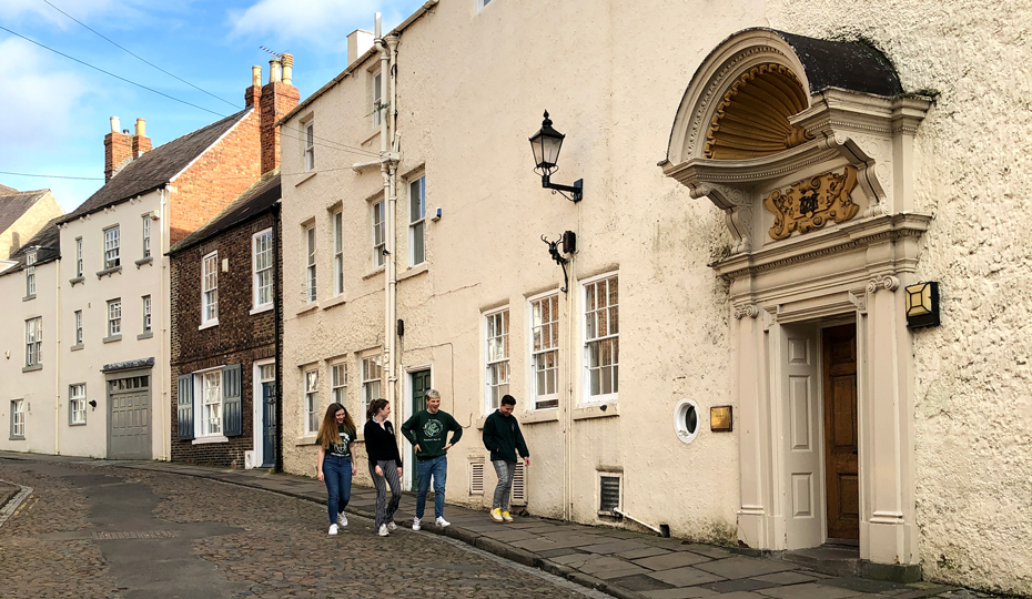 View of historical House 12 looking down the street towards the other Cuth’s buildings on the Bailey.