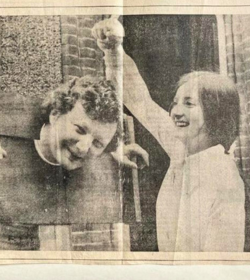 black and white photo of women with sponge over man's head