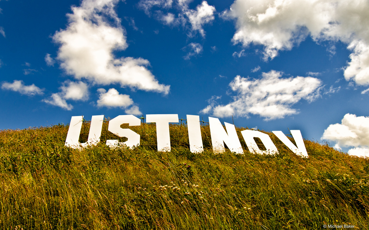 Ustinov sign in the style of the Hollywood sign on a hill with blue skies