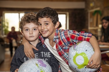 2 Children playing at a family event in College