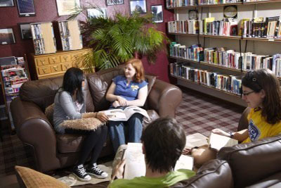 A group of postgraduate students relaxing in the Middle Common Room