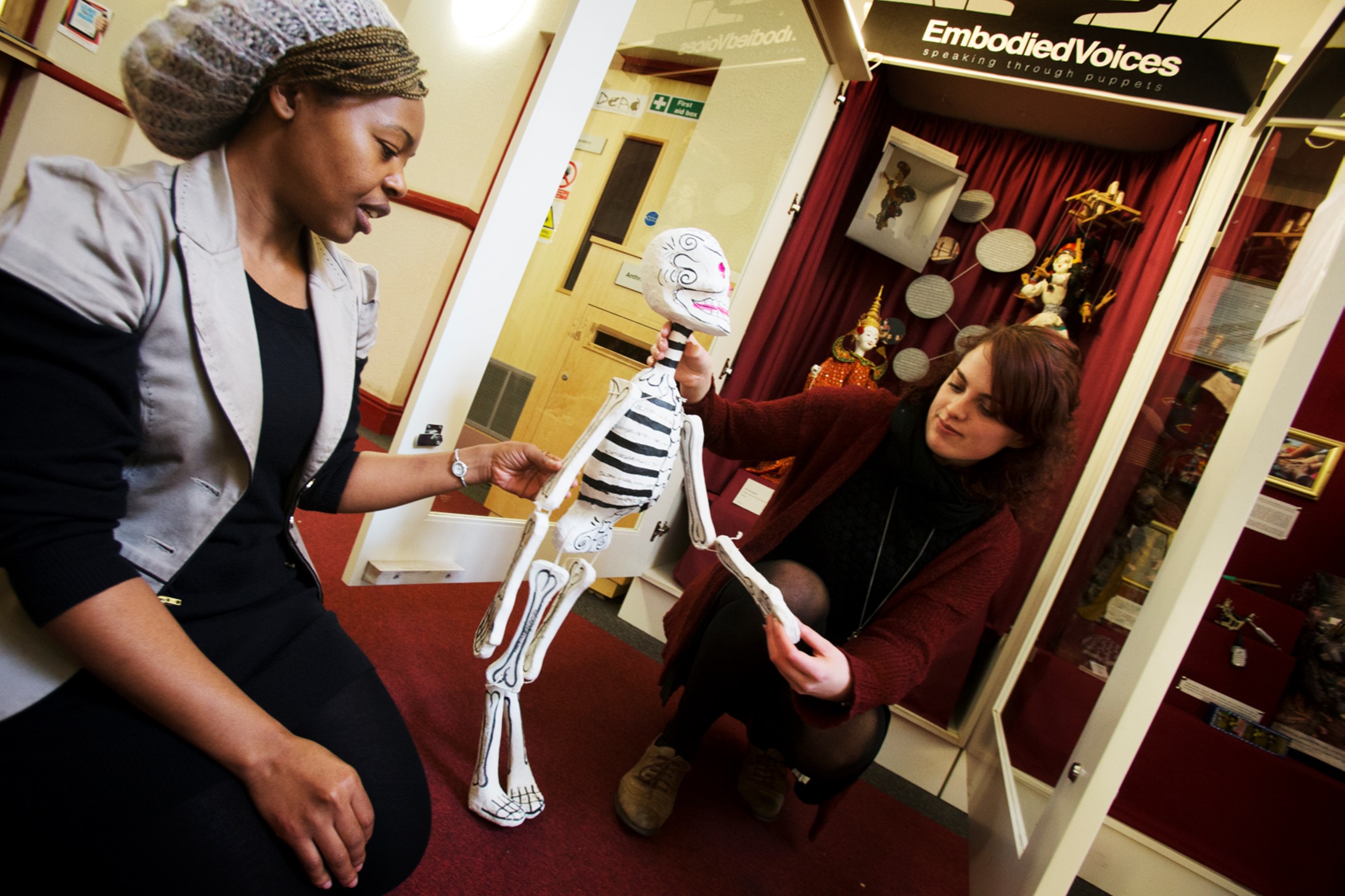 TStudents looking at a small model skeleton