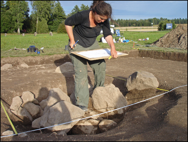 Sarah Semple drawing some stones uncovered in an excavation