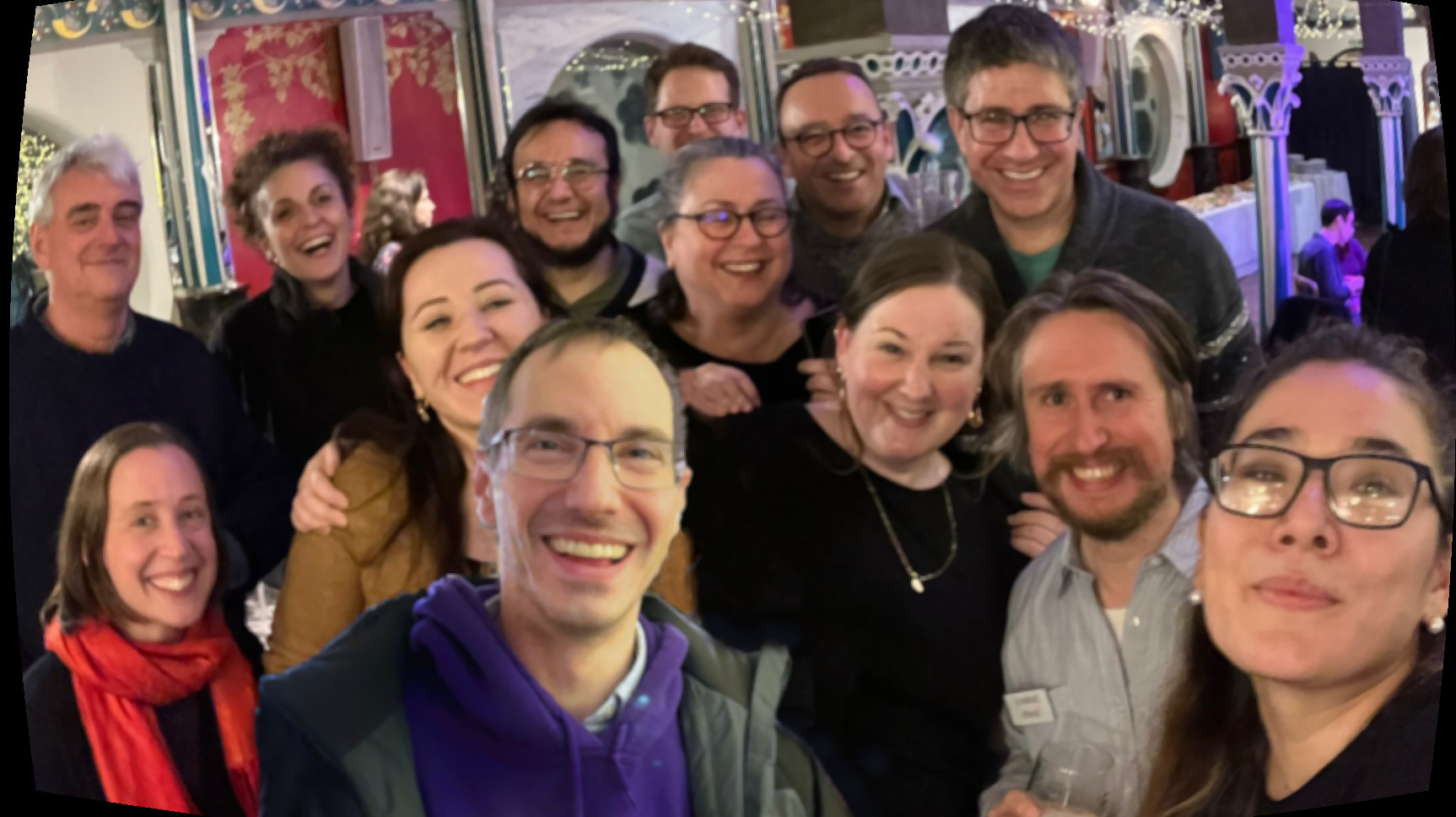 Group photo of smiling members of the Archaeology Department, at the conference celebration event.