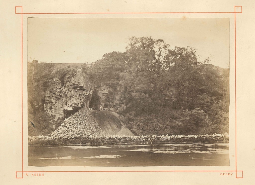 Old sepia photograph of a cave entrance
