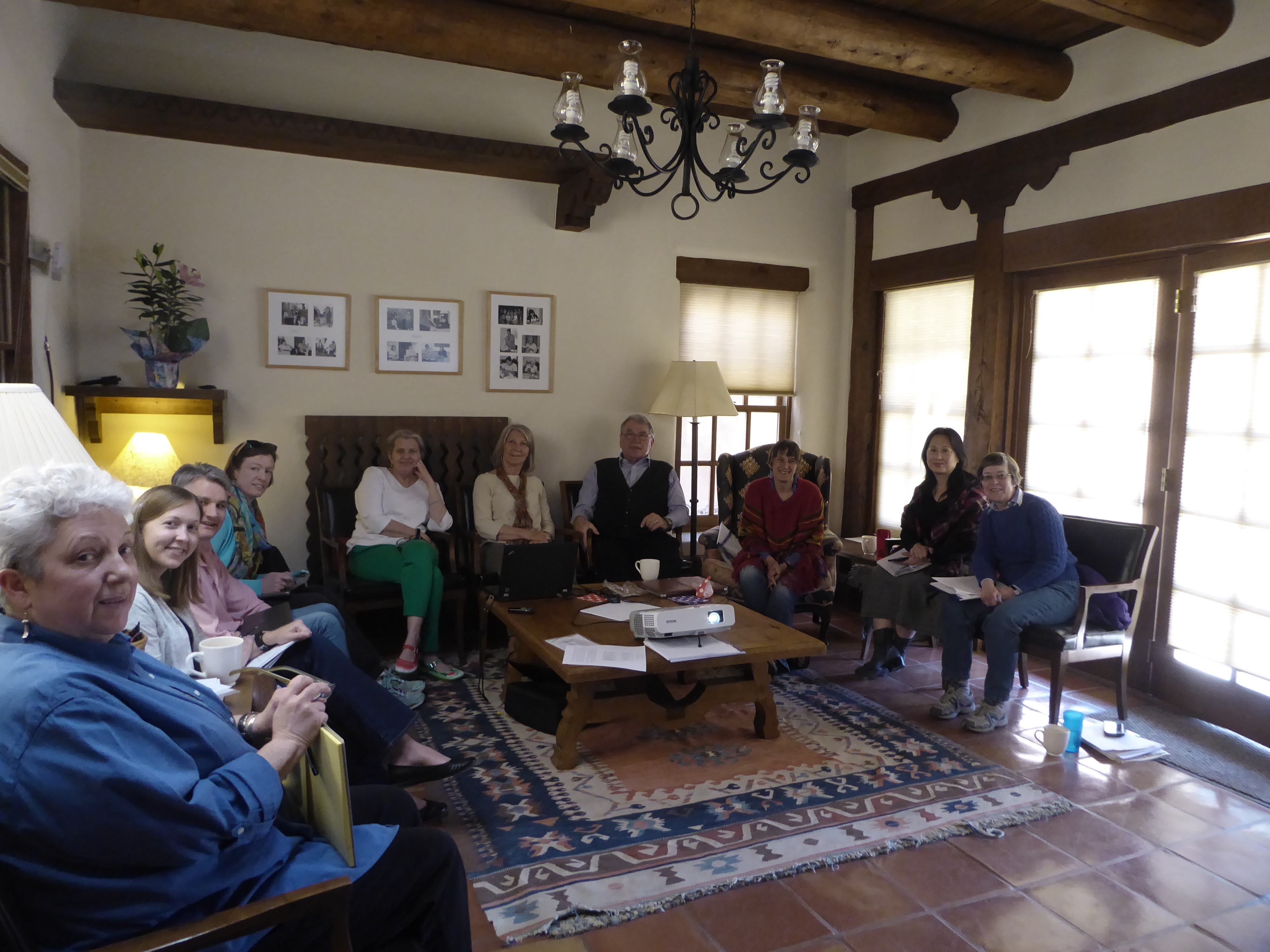 Group of academics sitting round a table at a seminar