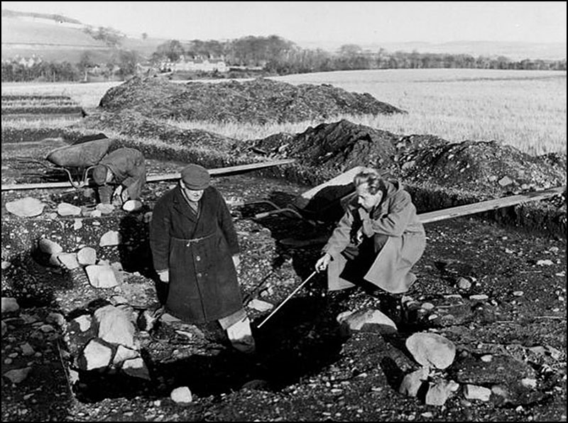 Black and White photograph of archaeologists excavating