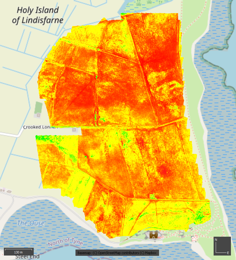 Aerial view of Holy Island of Lindisfarne, with a layer showing the Normalized Difference Vegetation Index (NDVI) of Lindisfarne.