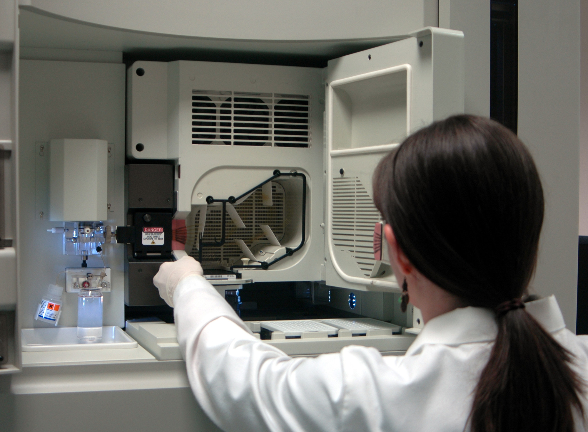 A person using a DNA Sequencing machine