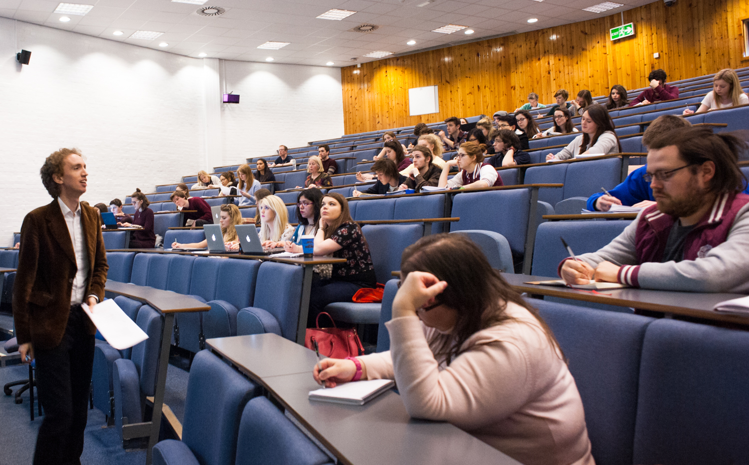Students seated in a lecture hall.