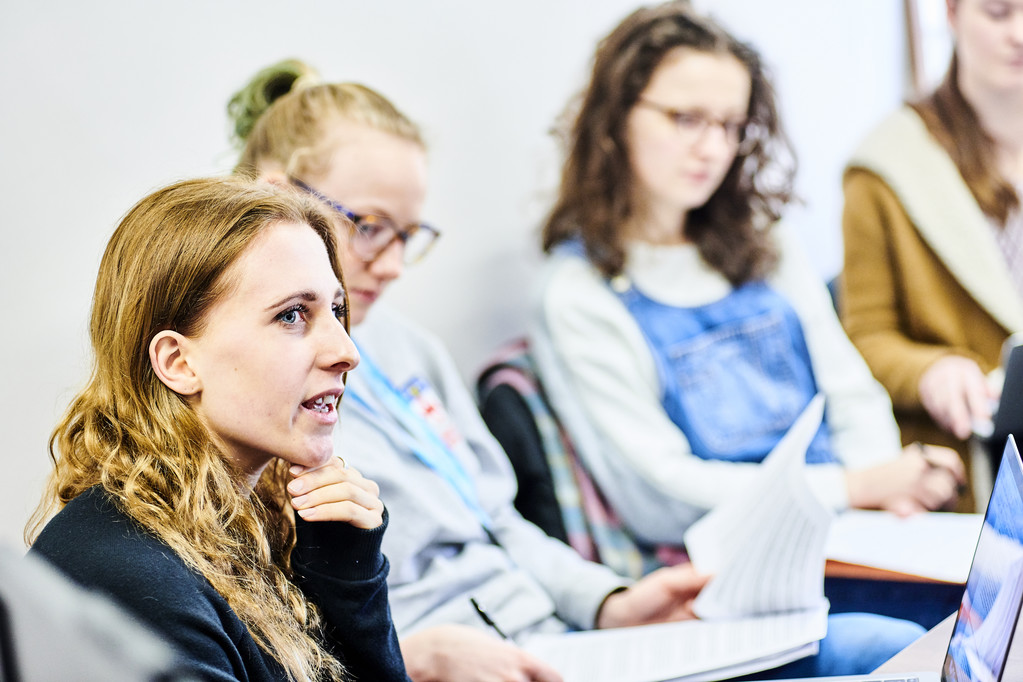 Three women attending a seminar