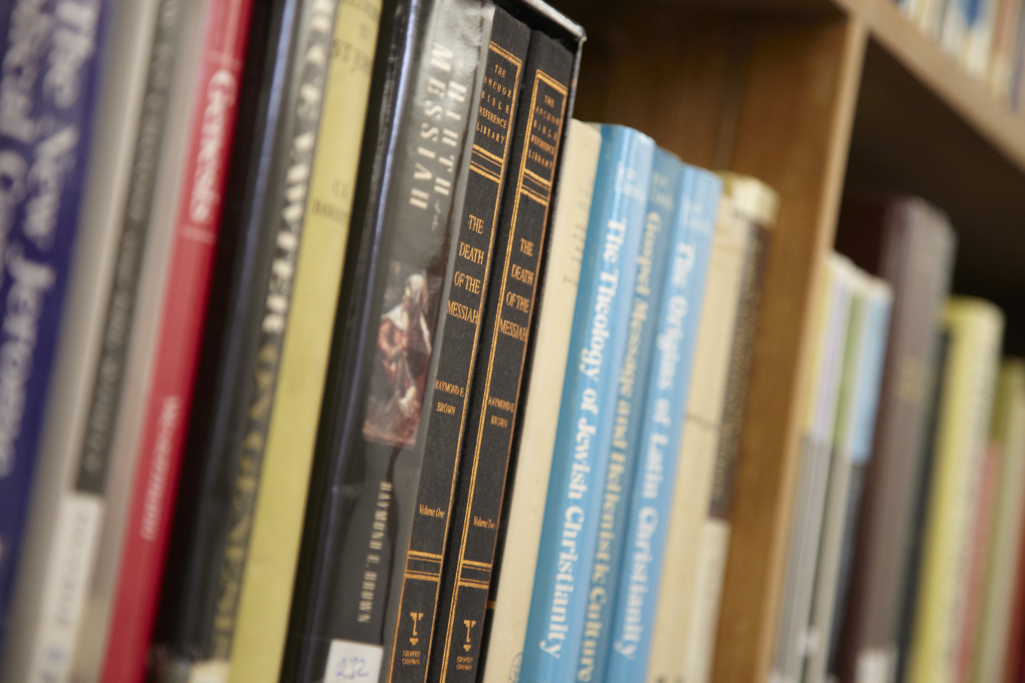 Theology books on a shelf close-up