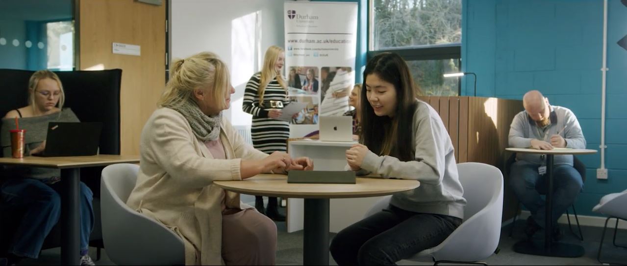 People sat at a table talking