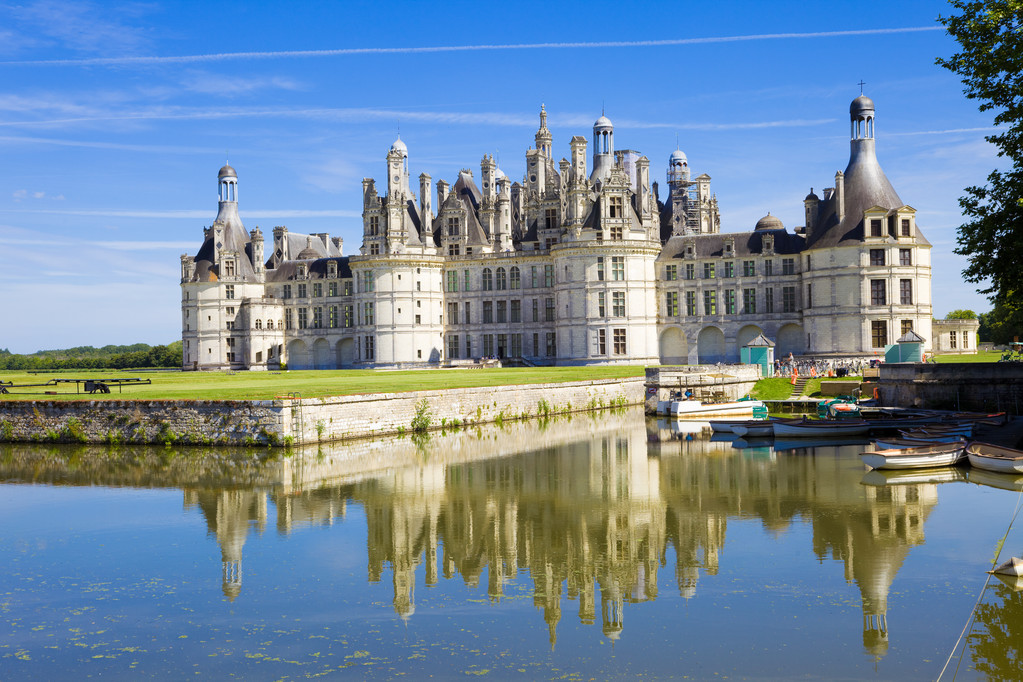 French chateau with canal reflection
