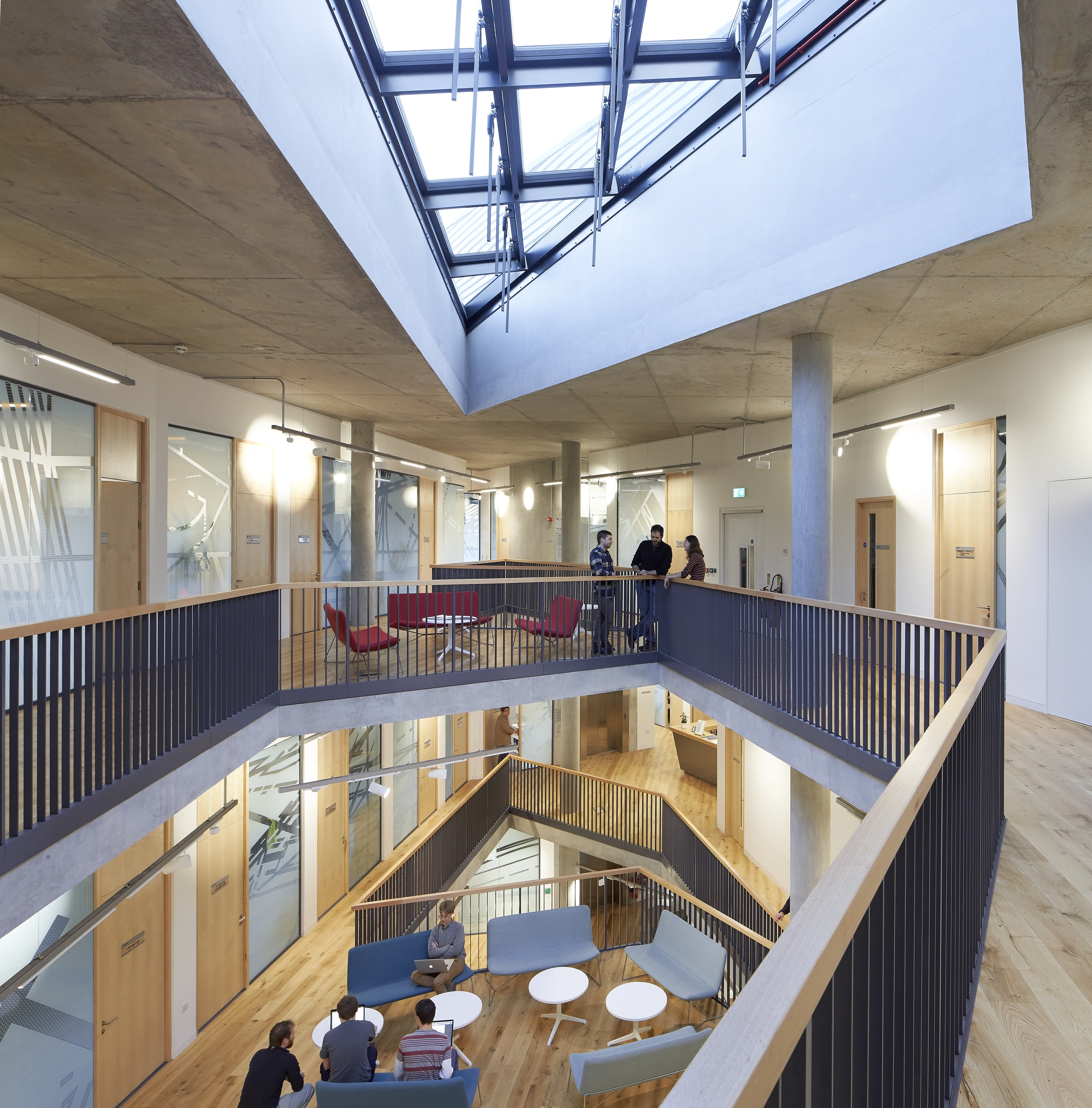 Ogden Centre West Interior with students socialising in an airy modern breakout space