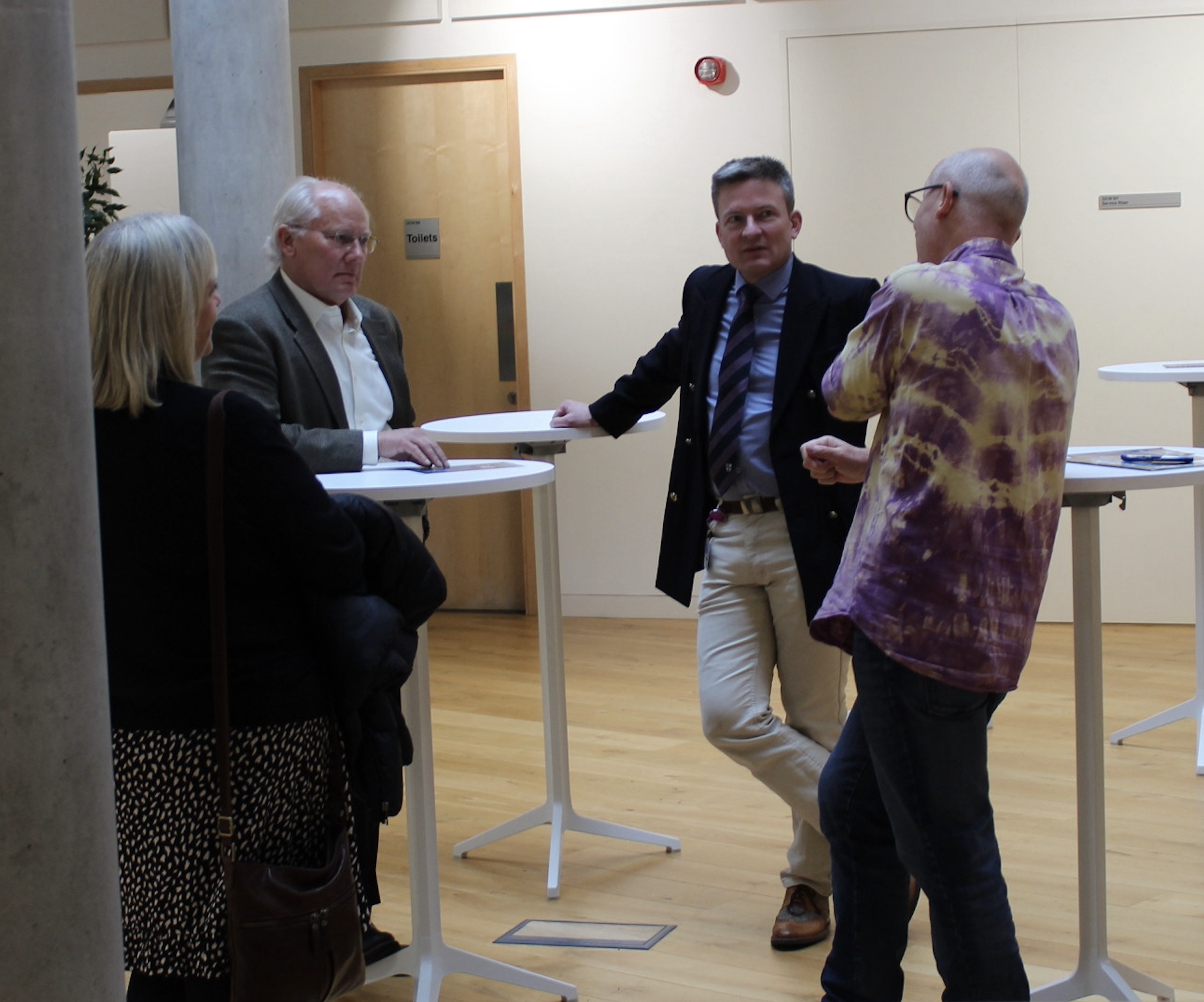 Andy Aldrin discusses with Pete Edwards and others in the Ogden Centre