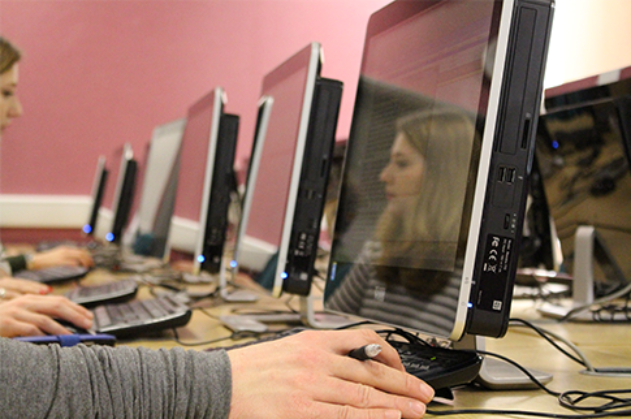 Students reflection in a computer screen