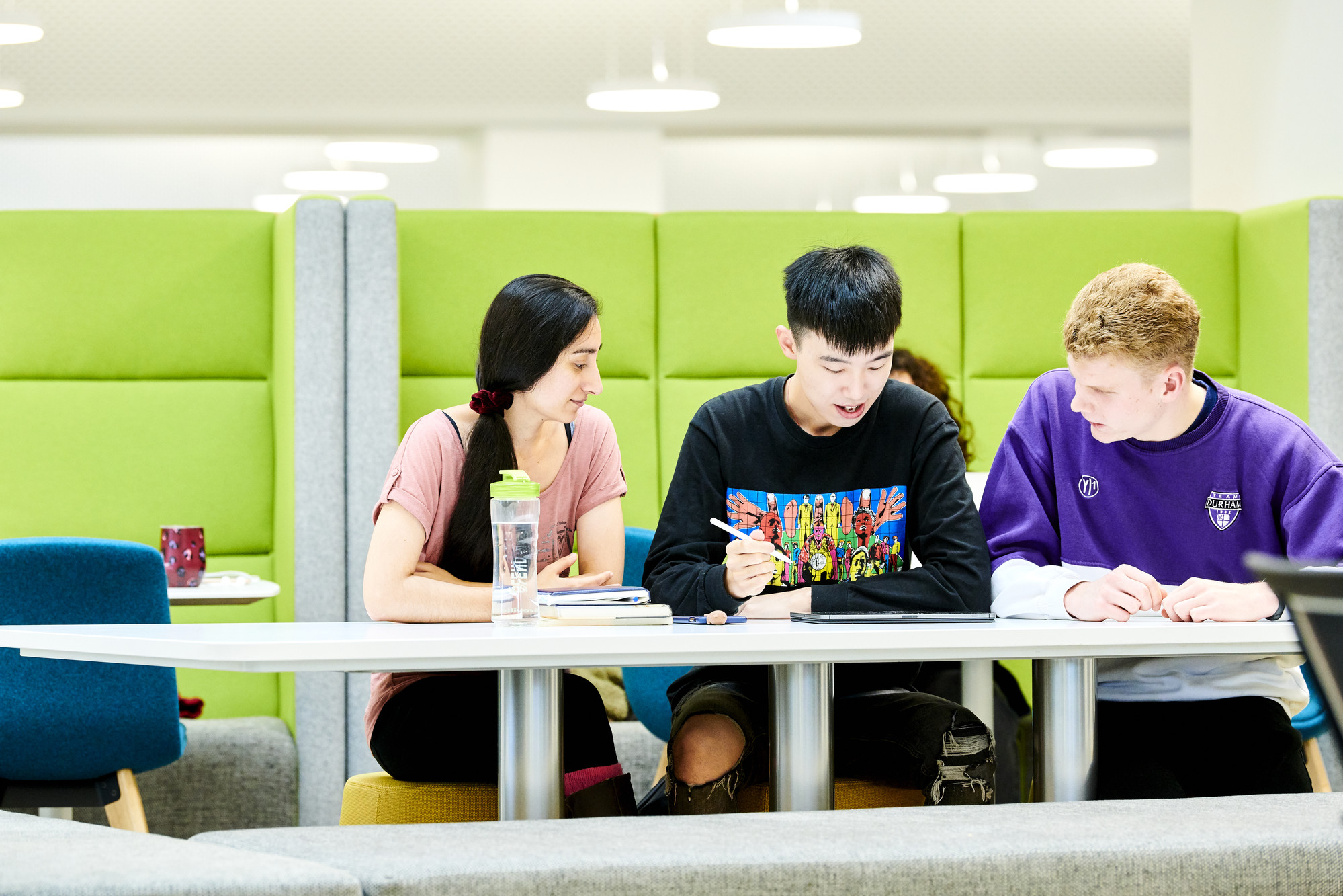 Three students studying in Teaching and Learning Centre