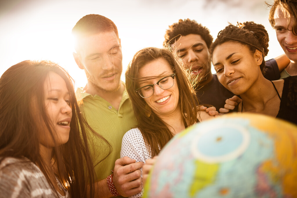 Students Smiling with Globe