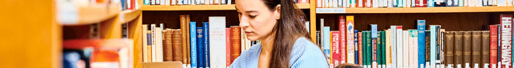 A student sitting in a library