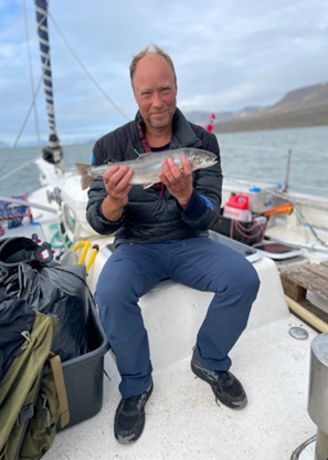 Man with with migratory Arctic charr